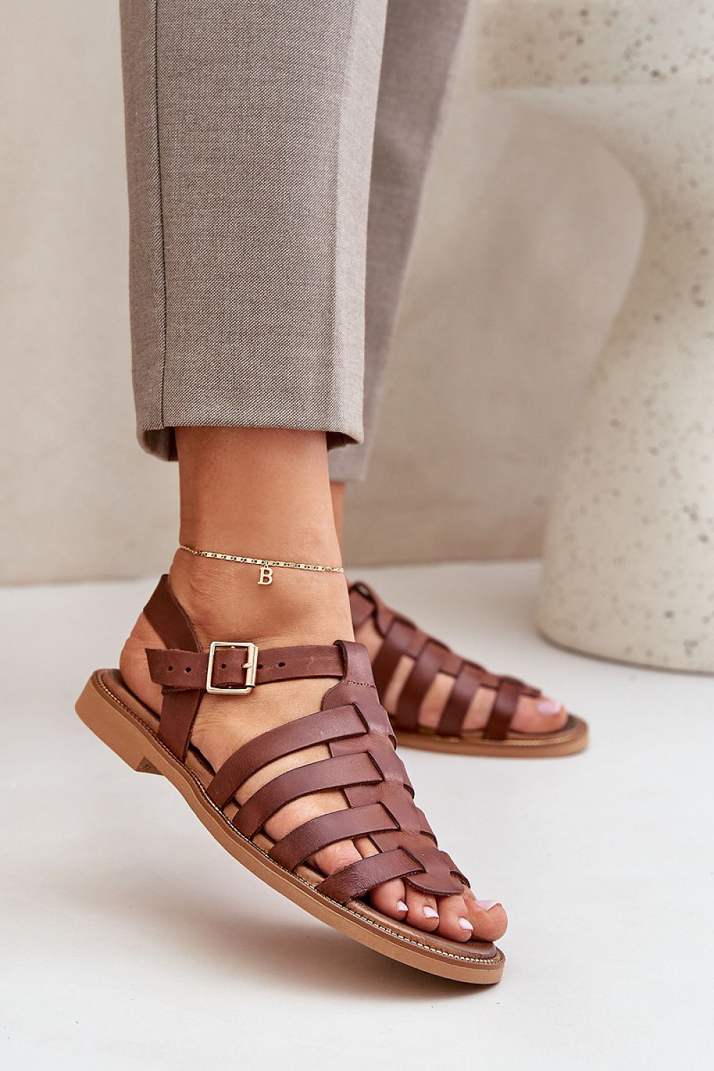 Avelisse Leather Flat Sandals with adjustable buckle and soft insole, shown in brown, perfect for casual and formal wear.