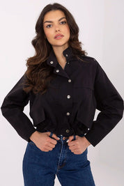 Woman wearing Corvaline Lightweight Windbreaker Jacket in black with snap-button placket and epaulets, paired with jeans.