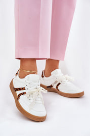 Person wearing Zyrmira Custom Lace Sport Sneakers with pink pants, showing eco leather and detachable lace accent for personalized style.