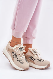 Person wearing Olivelle Wrapped Front Platform Shoes with suede-textured upper and subtle slogan, styled for casual comfort and daily walks.
