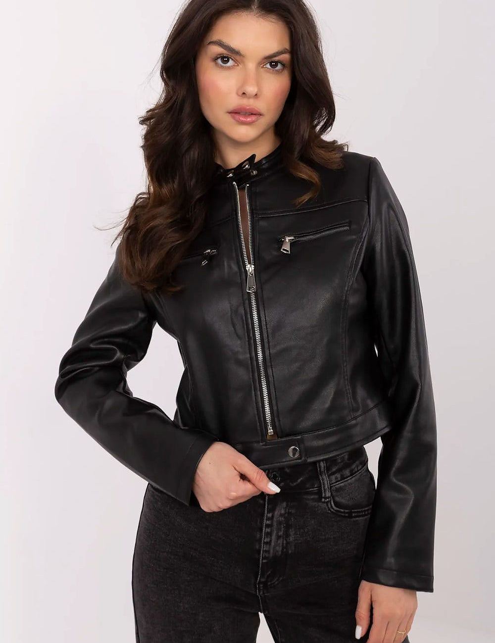 Woman wearing Corvanelle Eco-Leather Zip Jacket, short fitted design, smooth finish, ideal for casual and semi-formal styling.