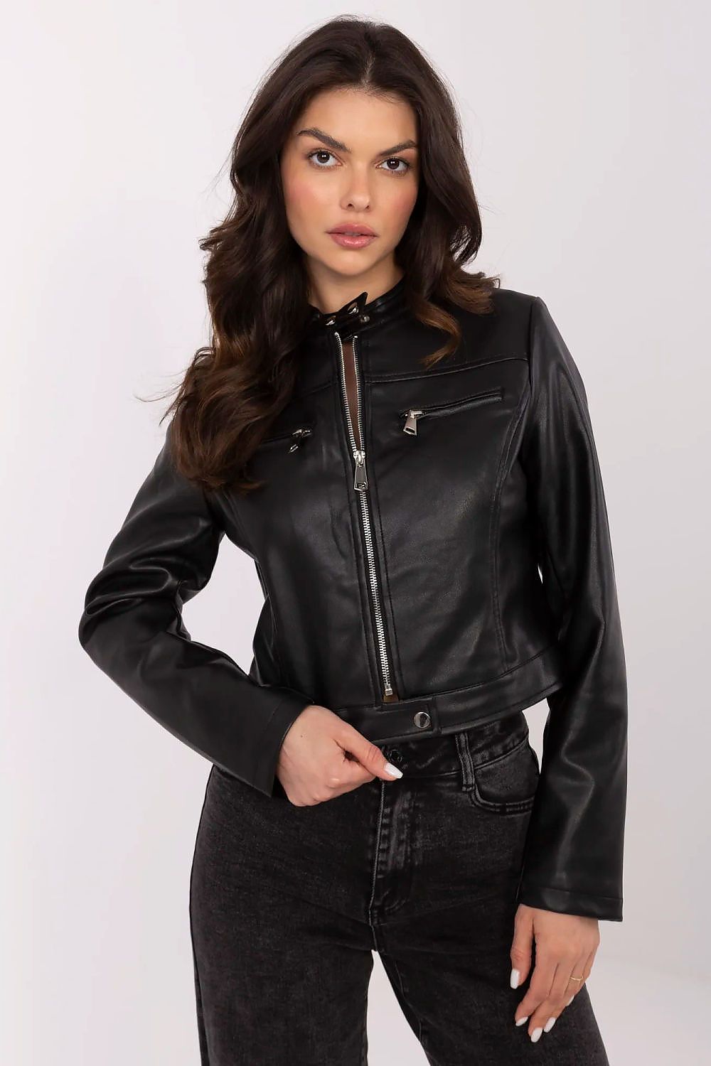 Woman wearing Corvanelle Eco-Leather Zip Jacket, short fitted design, smooth finish, ideal for casual and semi-formal styling.