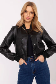 Woman wearing Velvaris Eco-Leather Bomber Jacket with snap-button closure and front flap pockets, styled for transitional seasons.