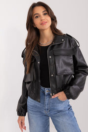 Woman wearing Arvenique Eco-Leather Short Jacket with front flap pockets and shoulder epaulettes, styled casually with jeans.