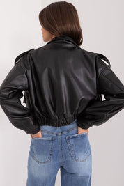 Back view of a person wearing an Arvenique Eco-Leather Short Jacket with jeans, featuring shoulder epaulettes and long sleeves.