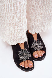 Fiorenna Flat Suede Flower Sandals with sculpted floral accents, cushioned insole, and adjustable ankle strap for all-day comfort.