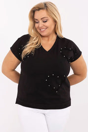 Woman wearing Arlenna Plus Size Sweetheart Blouse in black with pearl accents, showcasing comfortable and flattering fit.