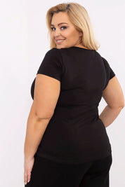 Back view of a woman wearing a black Elvarra Plus Size Cotton Tee with short sleeves and a round neckline.