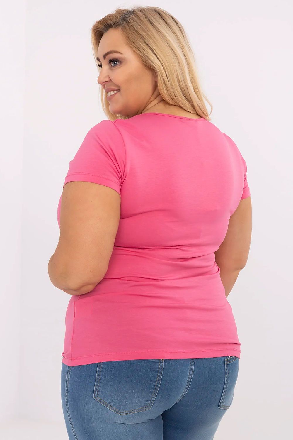 Back view of woman wearing pink Elvarra Plus Size Cotton Tee with short sleeves and classic round neckline, perfect for casual style.