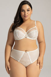 Model wearing Irissia Soft Plus Bra, showcasing seamless wire-free design with lace, in elegant muted tones for everyday comfort.