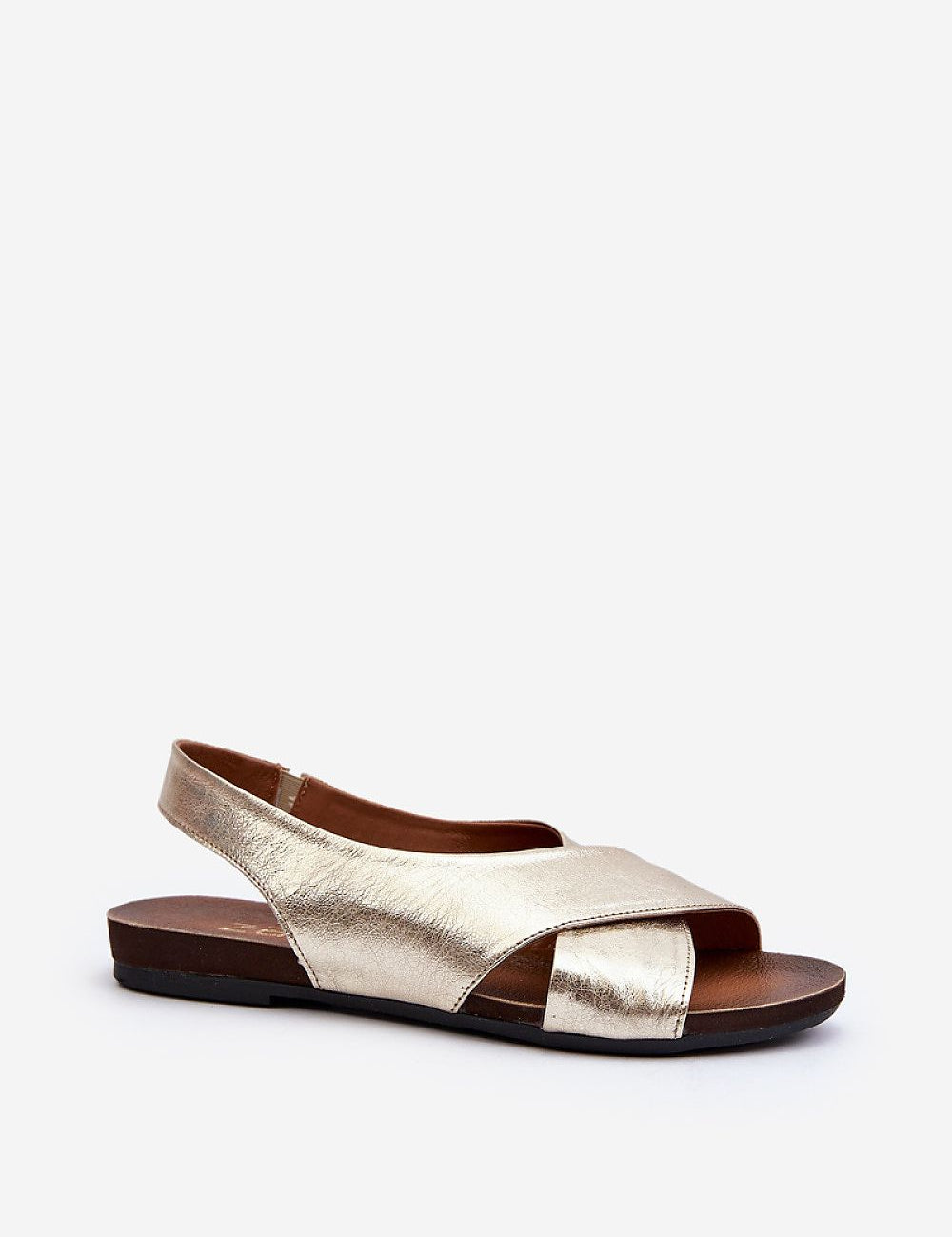 Talmea soft-strap leather sandals in gold with open heel and toe, featuring a sleek silhouette and discreet elastic back strap for comfort.