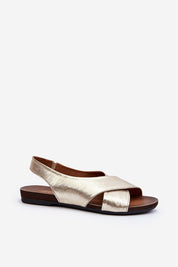 Talmea soft-strap leather sandals in gold with open heel and toe, featuring a sleek silhouette and discreet elastic back strap for comfort.