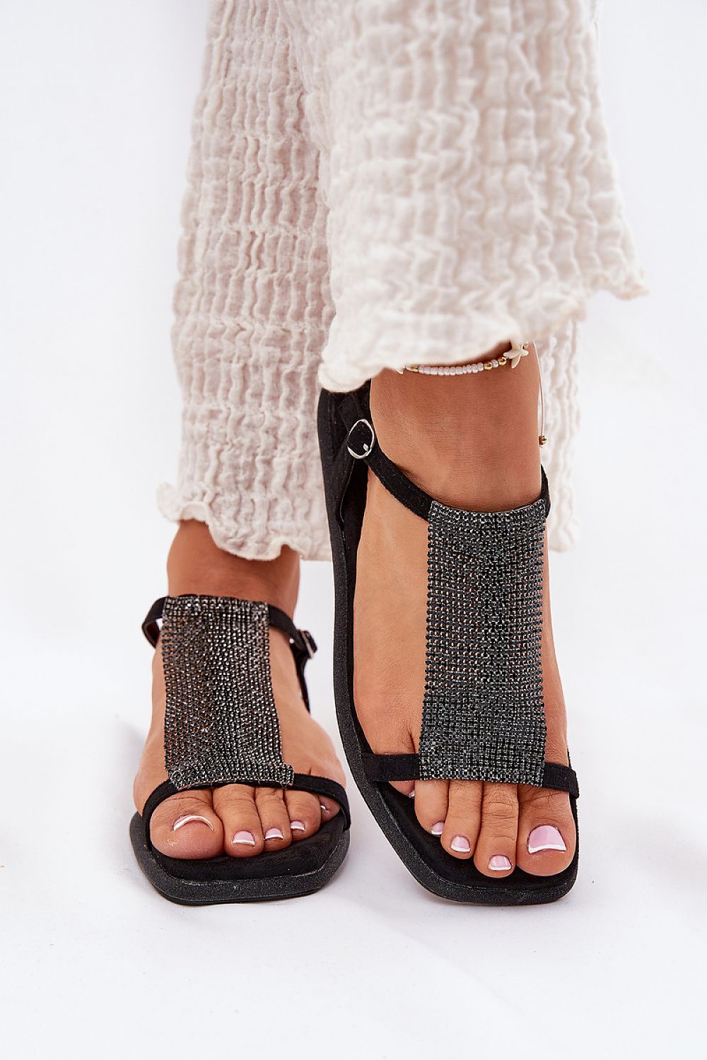 Cirellane Crystal Strap Sandals with shimmering crystals and adjustable buckle, elegant flat footwear for evening gatherings.