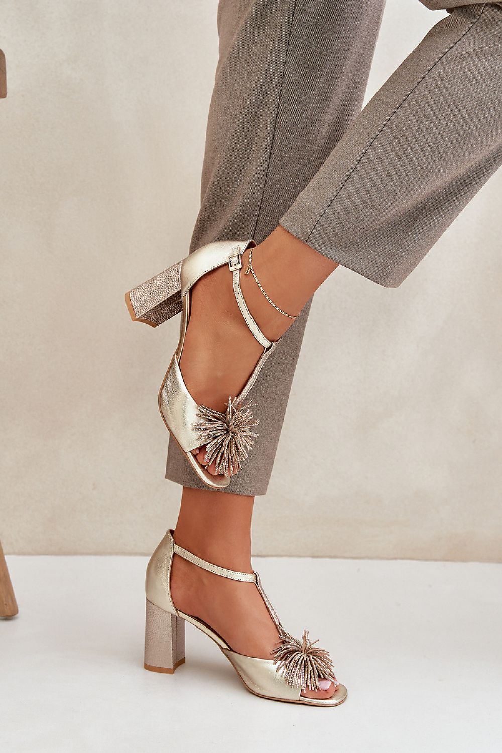 Tirelda Leather Column Heel Sandals with decorative front accent and adjustable strap, featuring soft leather insole and closed back support.