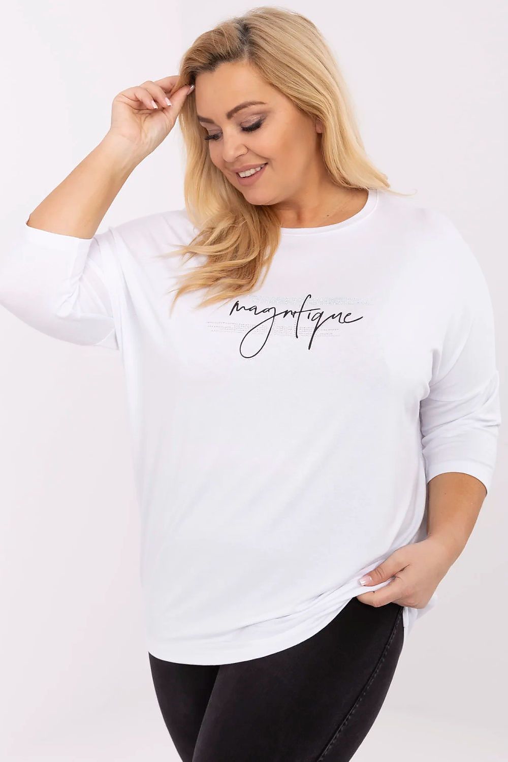 Plus size model wearing Lioraelle printed jet blouse with 3/4 sleeves, white color, featuring elegant script and casual look.