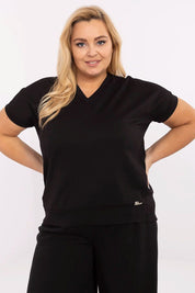 Plus size V-neck blouse in black, shown on model with short sleeves, designed for comfort and elegance, perfect for layering.