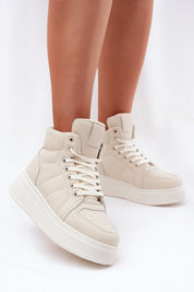 Woman wearing Cavora Platform High-Top Sneakers in smooth eco leather with 4 cm platform and 10 cm upper for a modern, stylish look.