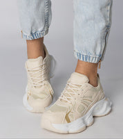 Thareen Platform Trainers with chunky sole and faux leather finish, worn with light jeans, featuring animal-inspired embossed texture.