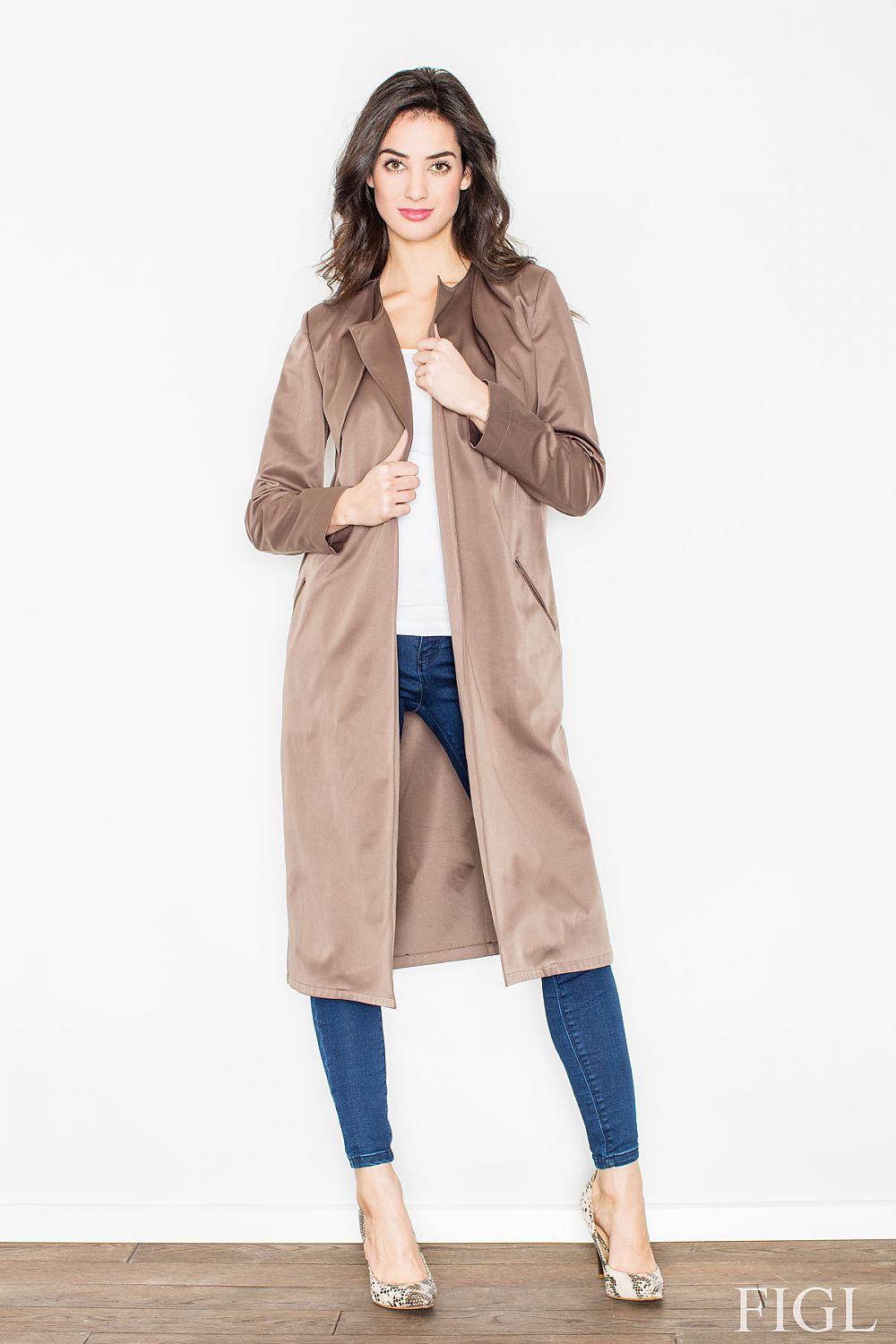 Woman wearing Selvarra Belted Knit Long Coat, taupe, open front, standing indoors, styled with jeans and heels.