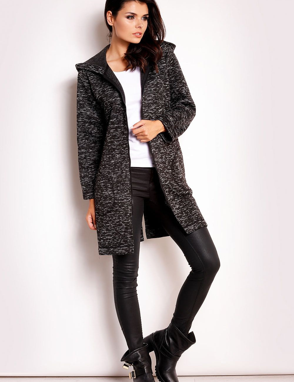 Woman wearing Merivonne Knit Hooded Zip Coat with wide collar, deep pockets, and relaxed fit, showcasing elegant and casual style.