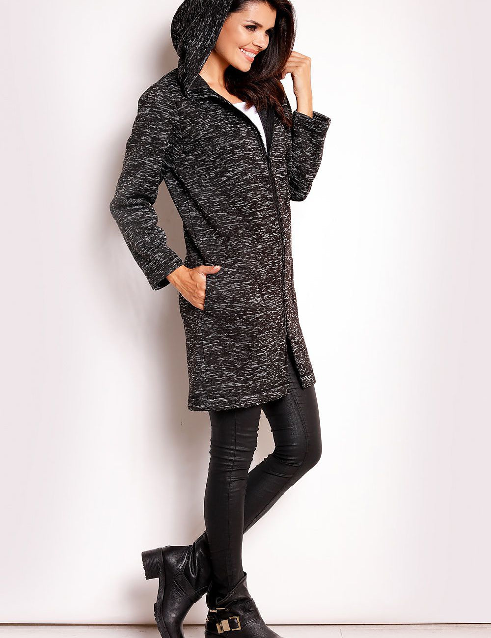 Woman modeling Merivonne Knit Hooded Zip Coat, featuring a wide collar hood, deep pockets, and exposed zip closure, offering casual elegance.