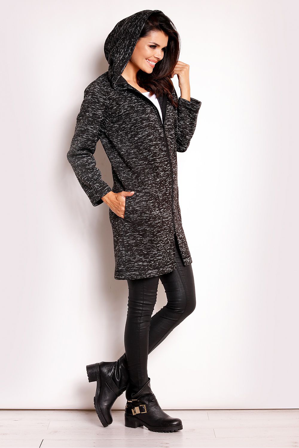 Woman modeling Merivonne Knit Hooded Zip Coat, featuring a wide collar hood, deep pockets, and exposed zip closure, offering casual elegance.