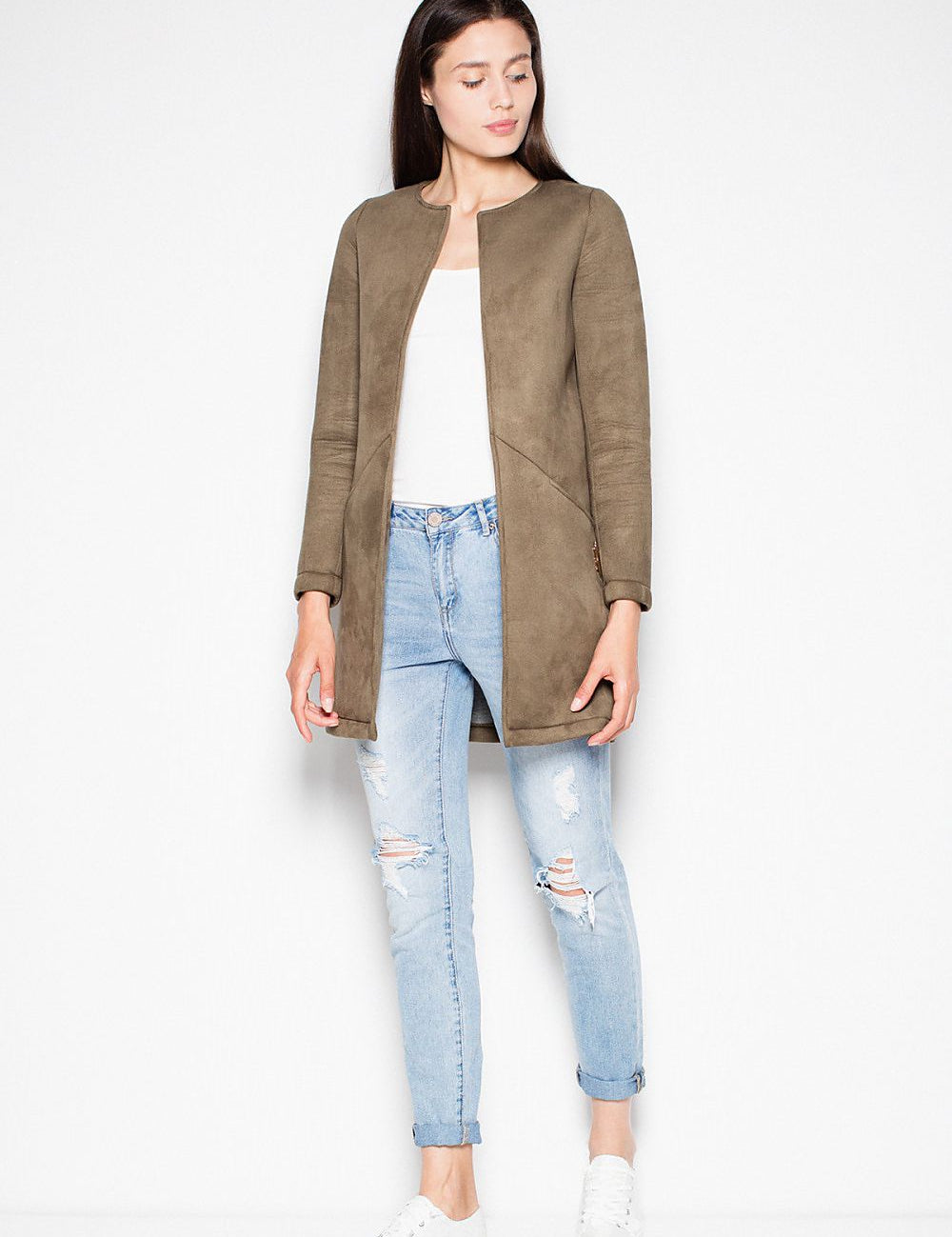 Woman wearing Rovienne open-front coat with topstitching, paired with jeans and white sneakers. Ideal for versatile, everyday style.