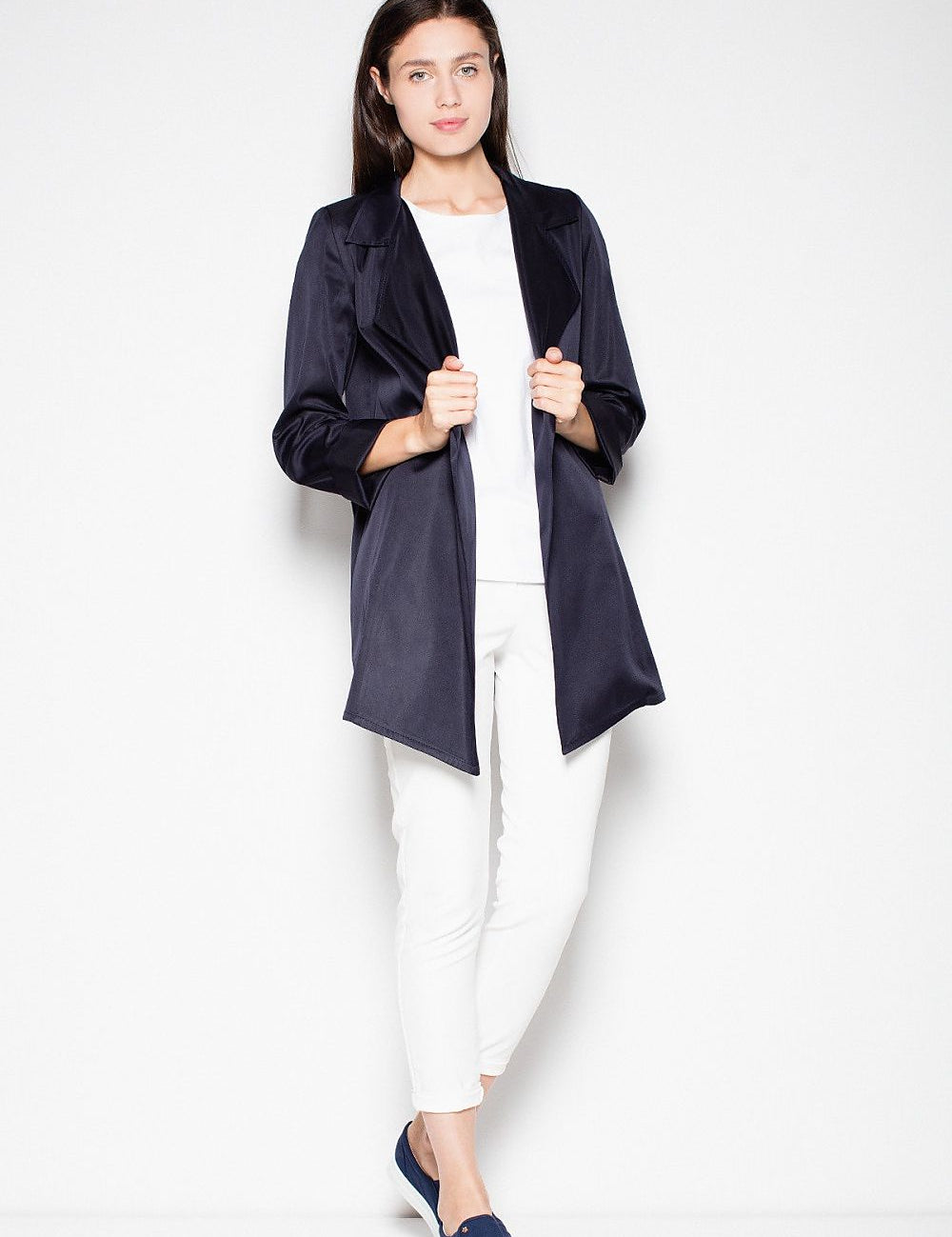 Woman modeling the Laverinne Classic Open-Front Coat with decorative collar and side pockets, showcasing its timeless design and versatility.