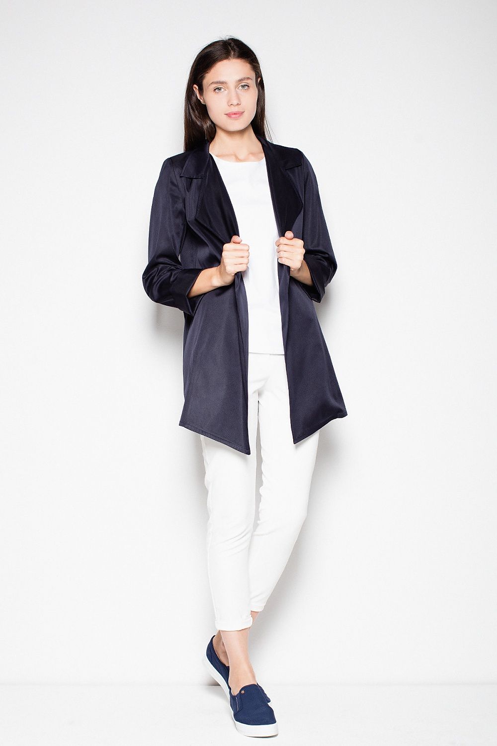 Woman modeling the Laverinne Classic Open-Front Coat with decorative collar and side pockets, showcasing its timeless design and versatility.