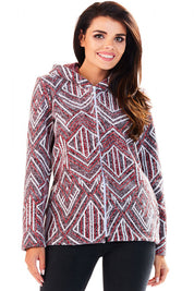 Woman wearing Marquetta Patterned Hooded Jacket with geometric design, full-length zip, and side pockets, ideal for casual wear.
