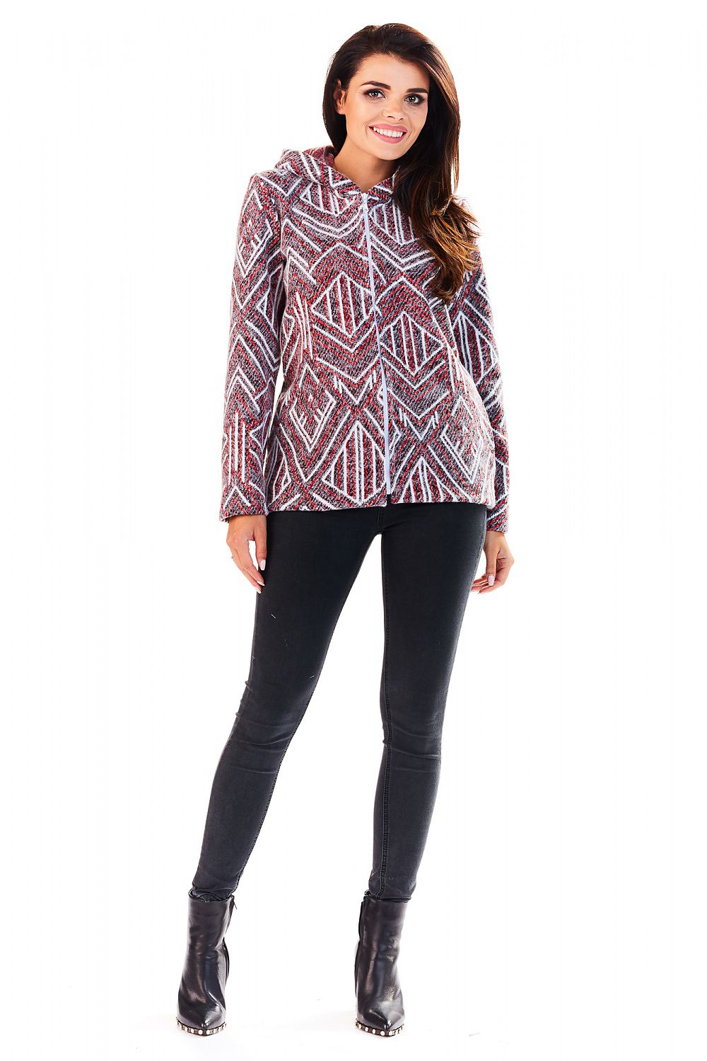 Woman wearing Marquetta Patterned Hooded Jacket with geometric design and full zip, styled with black pants and boots for a casual look.