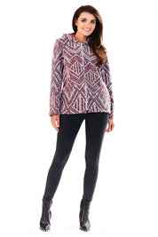 Woman wearing Marquetta Patterned Hooded Jacket with geometric design and full zip, styled with black pants and boots for a casual look.