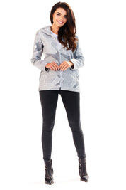 Woman wearing Marquetta Patterned Hooded Jacket with subtle pattern, full-length zip, and slide pockets, ideal for layering.