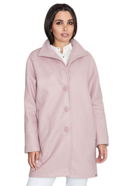 Model wearing pink Norivelle kimono-style lined coat with stand-up collar and buttons.