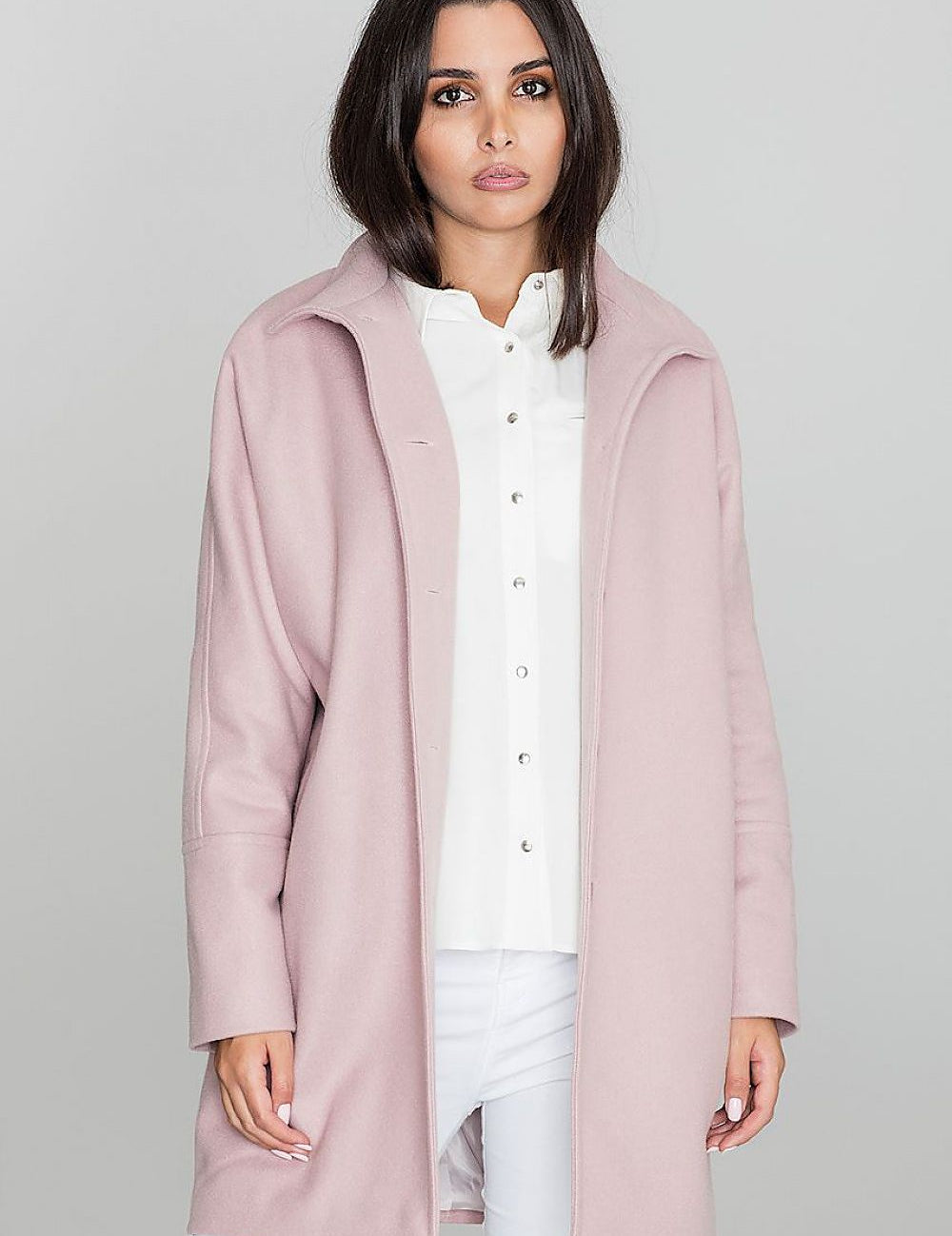 Woman wearing pink Norivelle Kimono-Style Lined Coat with stand-up collar and button fastening.