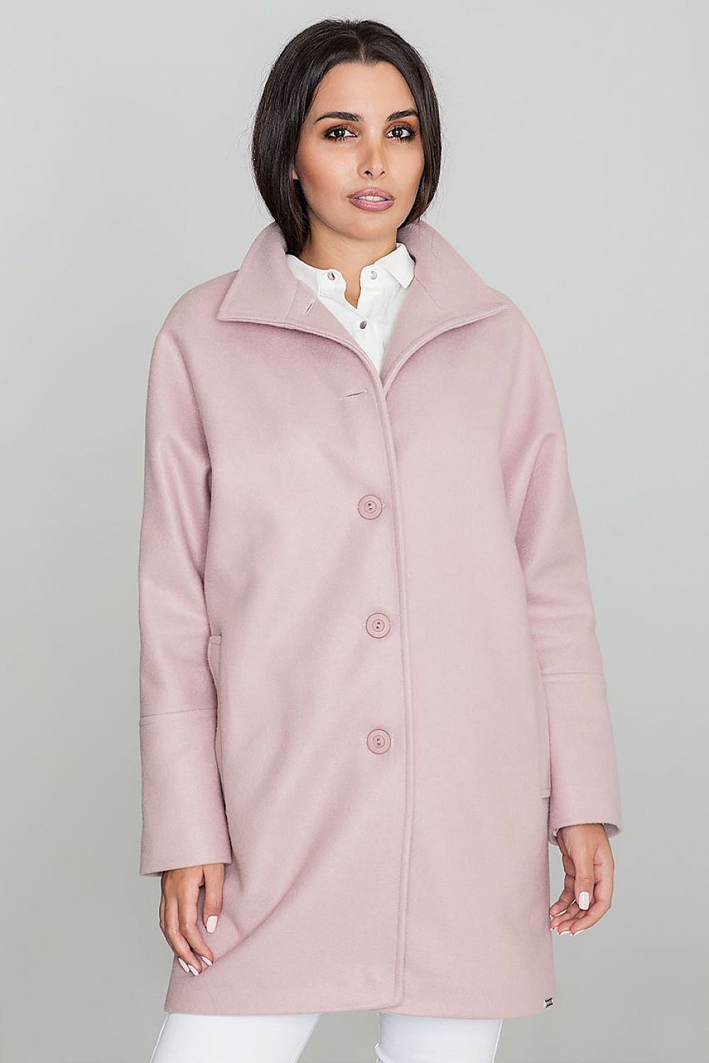 Woman wearing Norivelle Kimono-Style Lined Coat, featuring a loose fit, stand-up collar, and button fastening in soft pink color.