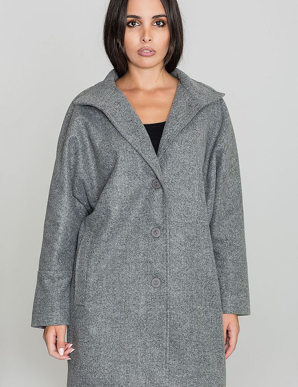 Woman wearing Norivelle Kimono-Style Lined Coat with button fastening and stand-up collar, showcasing elegant design and loose fit.