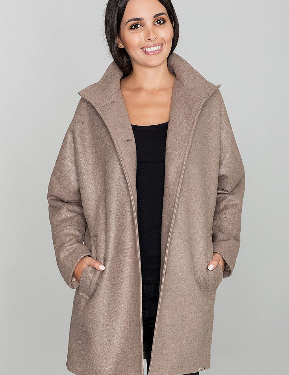 Woman wearing Norivelle Kimono-Style Lined Coat with stand-up collar, showing loose fit and pockets. Elegant and functional coat design.