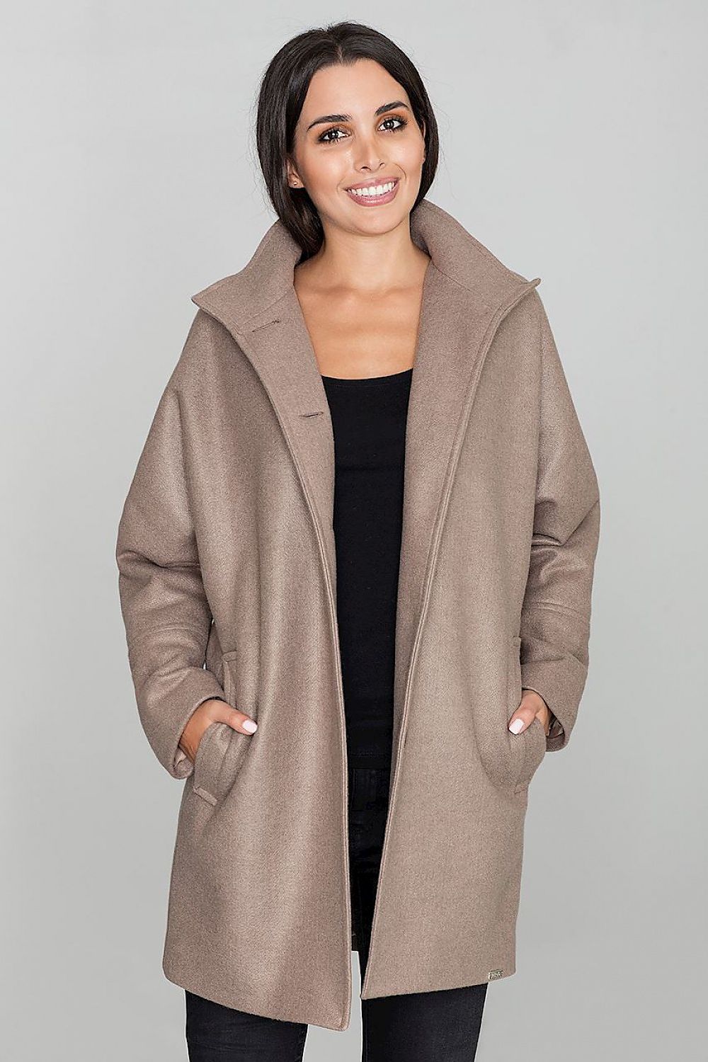 Woman wearing Norivelle Kimono-Style Lined Coat with stand-up collar, showing loose fit and pockets. Elegant and functional coat design.