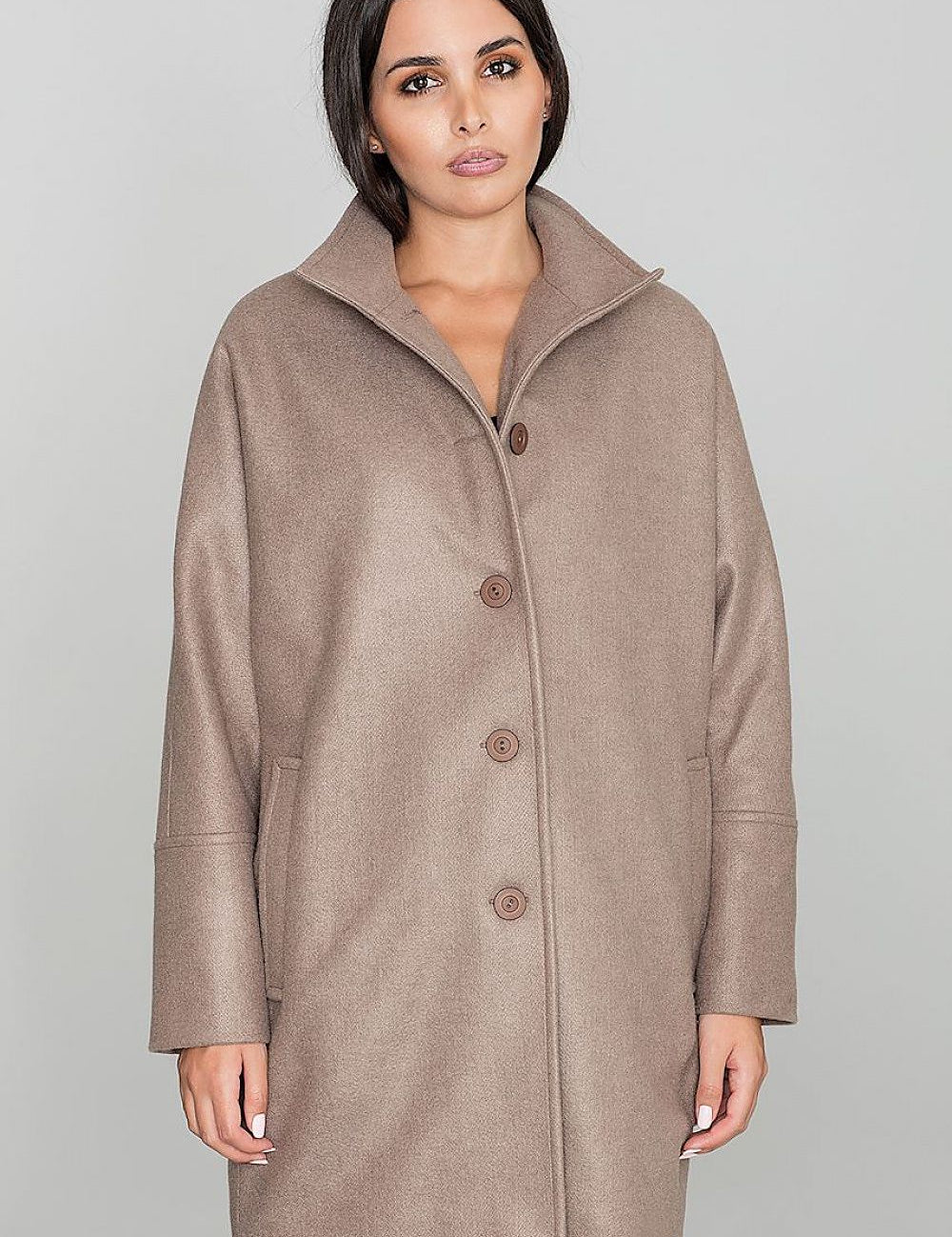 Woman wearing Norivelle kimono-style lined coat with stand-up collar and button fastening, showcasing elegant design and relaxed fit.