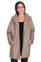 Woman wearing Norivelle Kimono-Style Lined Coat with stand-up collar and pockets, showcasing elegant and relaxed silhouette.