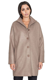 Woman wearing Norivelle Kimono-Style Lined Coat with stand-up collar and button fastening, showcasing elegant loose fit and practical pockets.