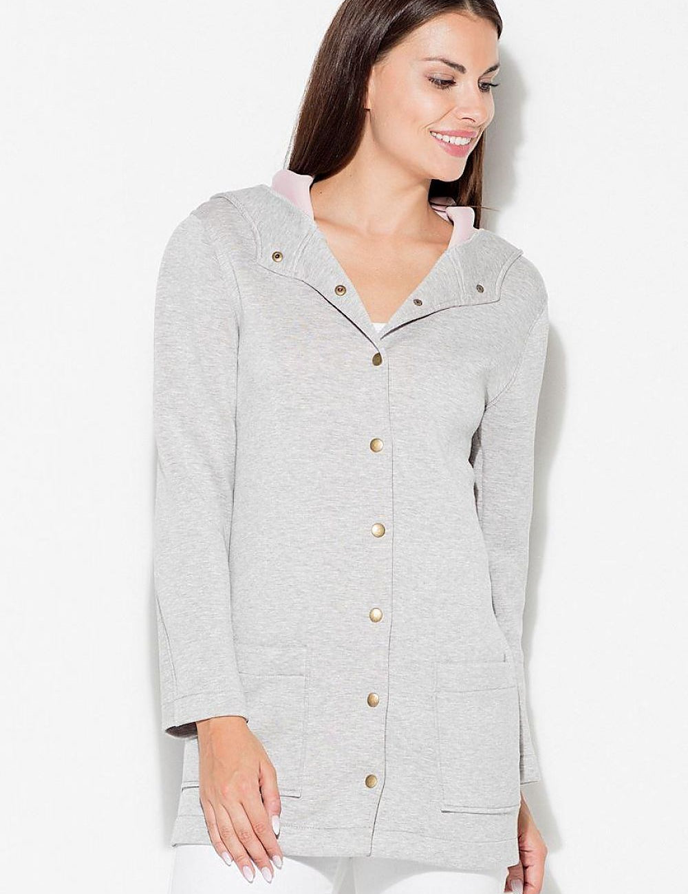 Woman wearing Katrienne Hooded Snap-Front Jacket with decorative press studs and large pockets, ideal for casual urban wear.