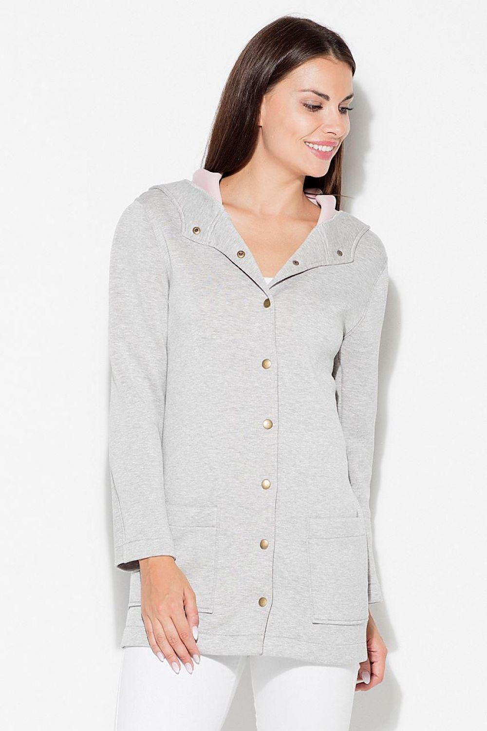 Woman wearing Katrienne Hooded Snap-Front Jacket with decorative press studs and large pockets, ideal for casual urban wear.