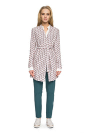 Woman wearing Orvianne Printed Belted Midi Coat with belted waist and tailored silhouette in elegant pattern.