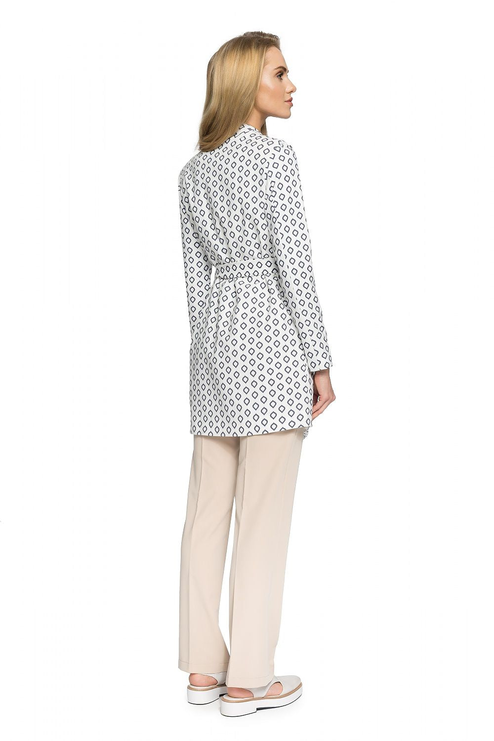 Back view of model wearing Orvianne Printed Belted Midi Coat with beige trousers, showcasing the coat's pattern and tailored fit.