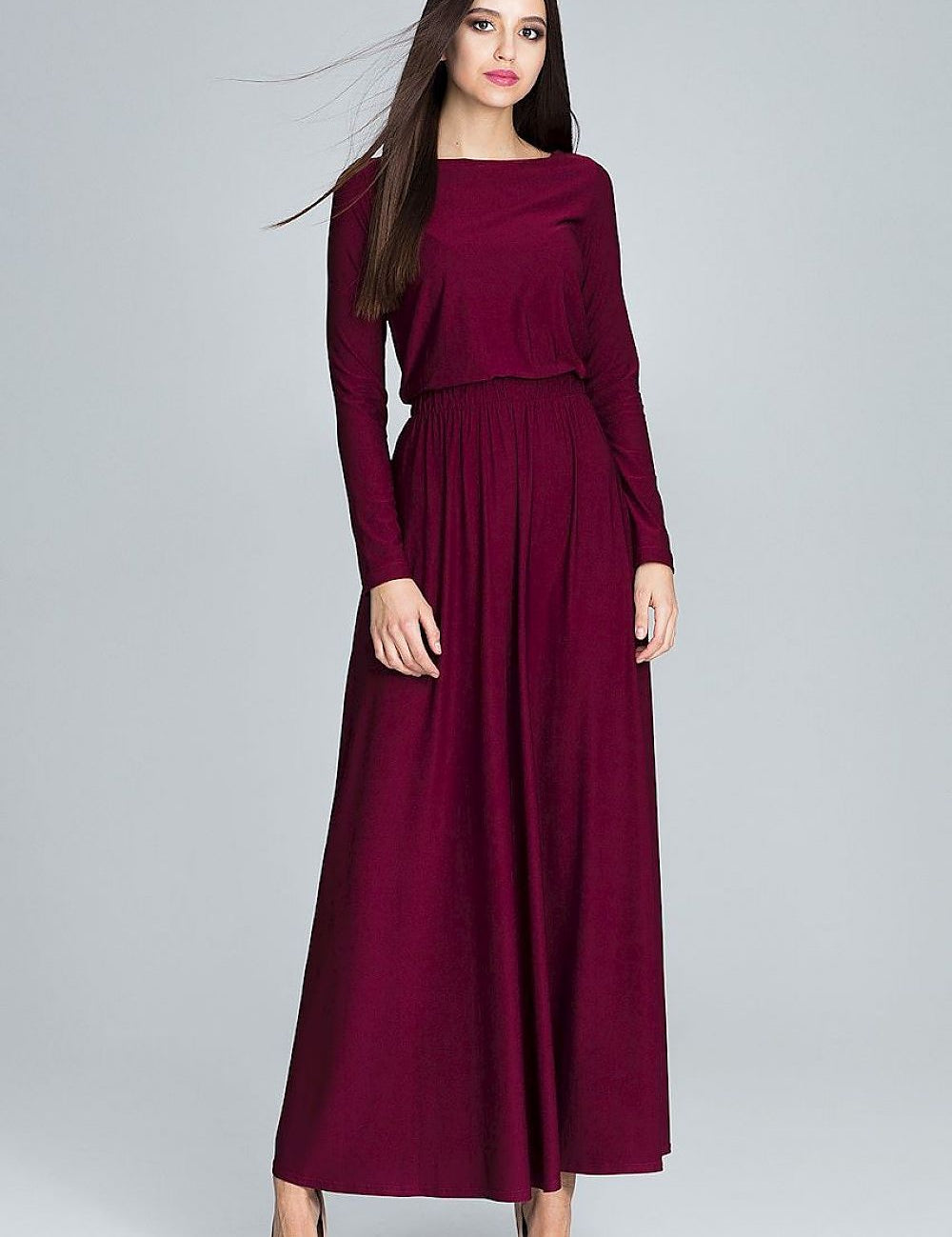 Elegant long-sleeve maroon maxi dress with clean lines, perfect for daytime outings and casual settings.