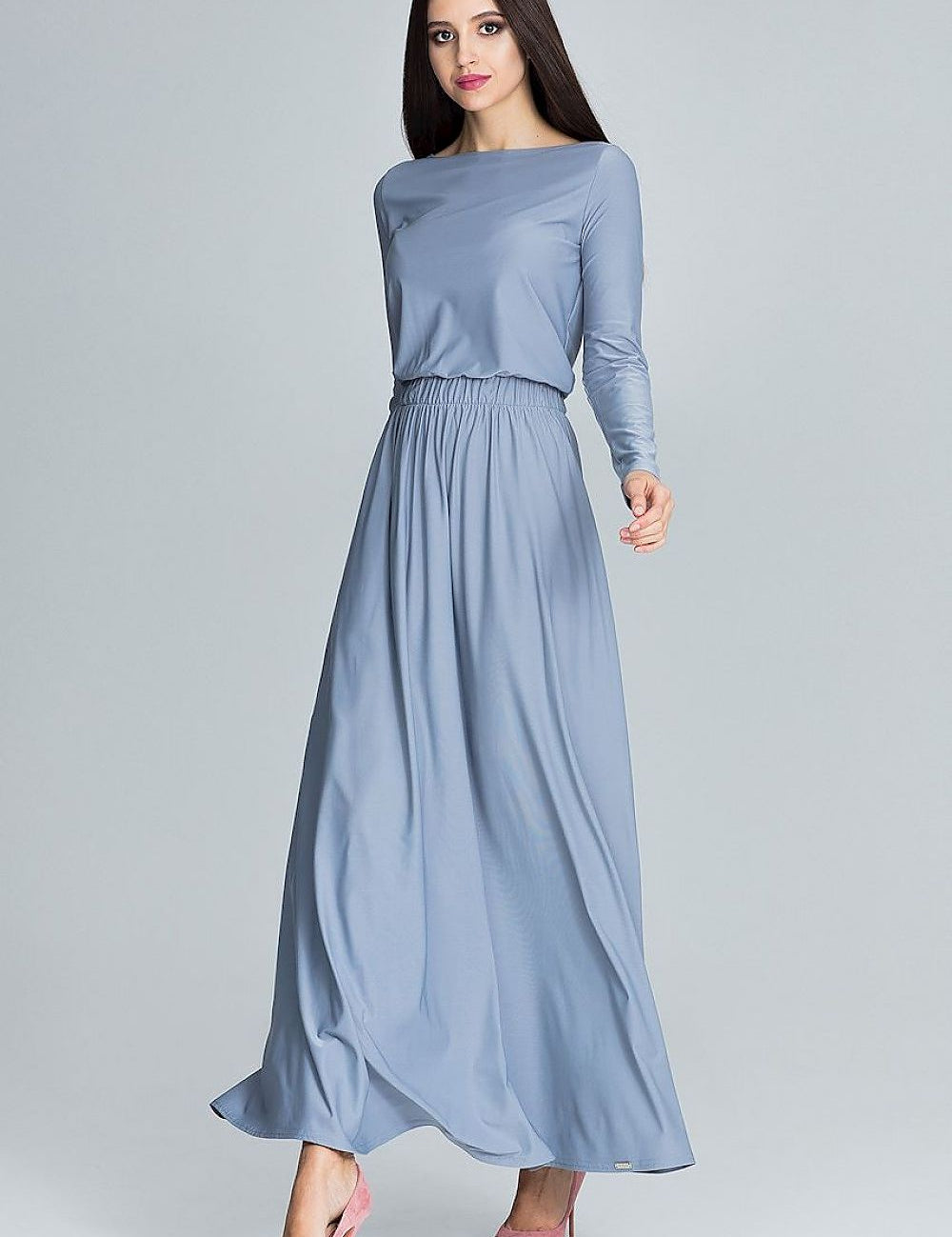 Model wearing Naleira Soft Drape Maxi Dress in light blue, showcasing an elegant long-sleeve design with a graceful, flowing silhouette.