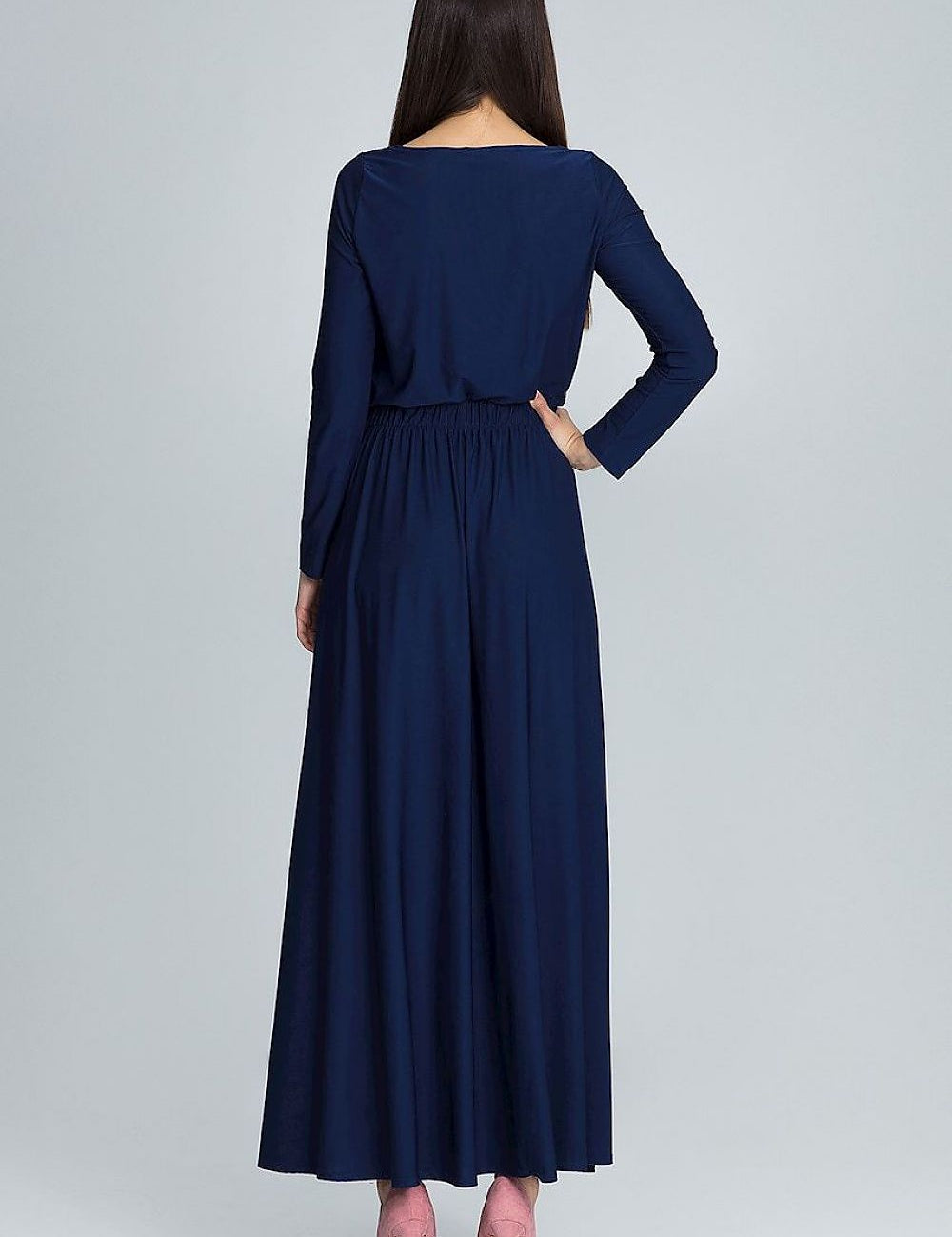 Back view of a woman wearing the Noraya Soft Drape Maxi Dress in navy, showcasing long sleeves and a relaxed silhouette.