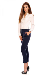 Woman wearing Plus Size Marvielle High-Waist 7/8 Trousers in navy, showcasing elegant style suitable for office or casual events.
